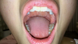 [Ultra rare, for enthusiasts, mouth, lips, tongue, throat, fetish] A close-up shot of the mouth of a young beautiful woman. Her tongue is long!