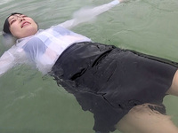 Beach fun in her wet suit